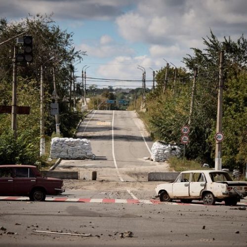 Damaged cars are seen in the town of Kupiansk, recently liberated by the Ukrainian Armed Forces, amid Russia's attack on Ukraine, in Kharkiv region, Ukraine, in this handout picture released September 19, 2022. Ukrainian Presidential Press Service/Handout via REUTERS